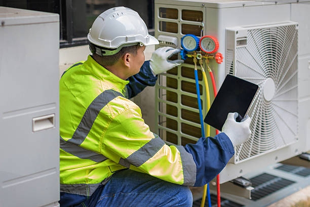 Professional Air Conditioning Repair technician working in Farley, MO